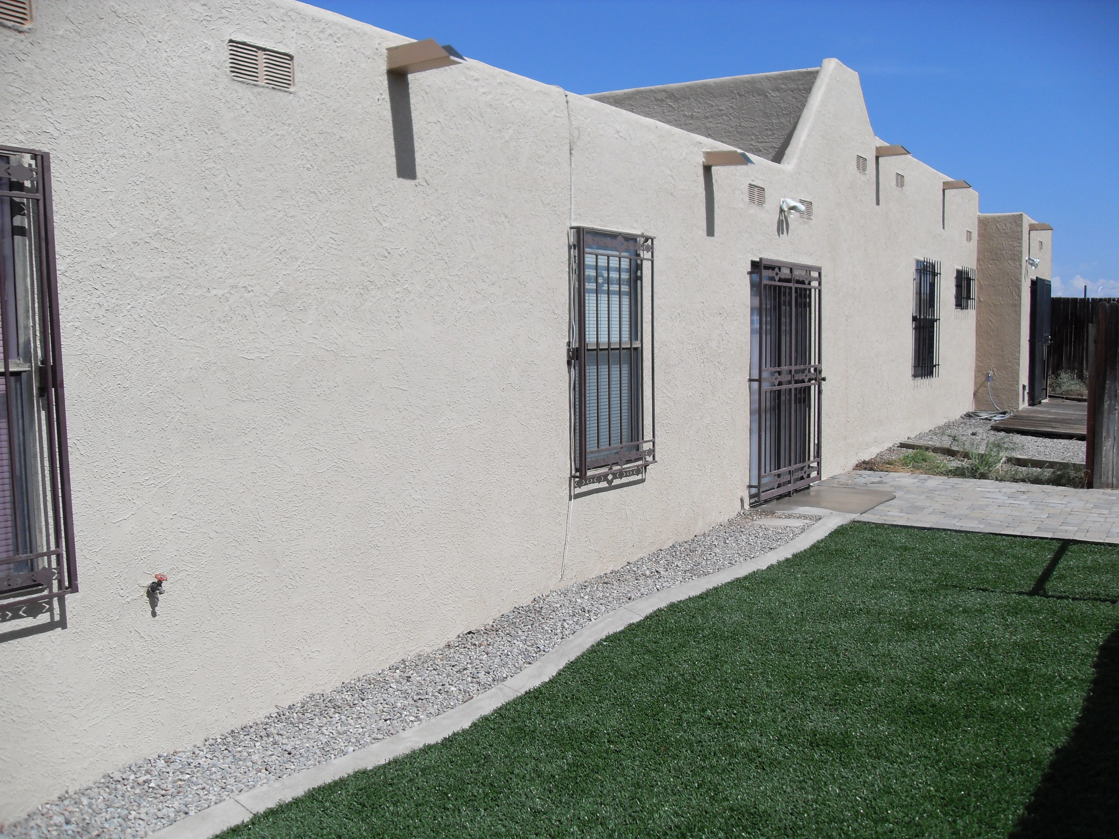 A peaceful expanse of green grass, creating a tranquil setting ideal for relaxation and outdoor activities.
